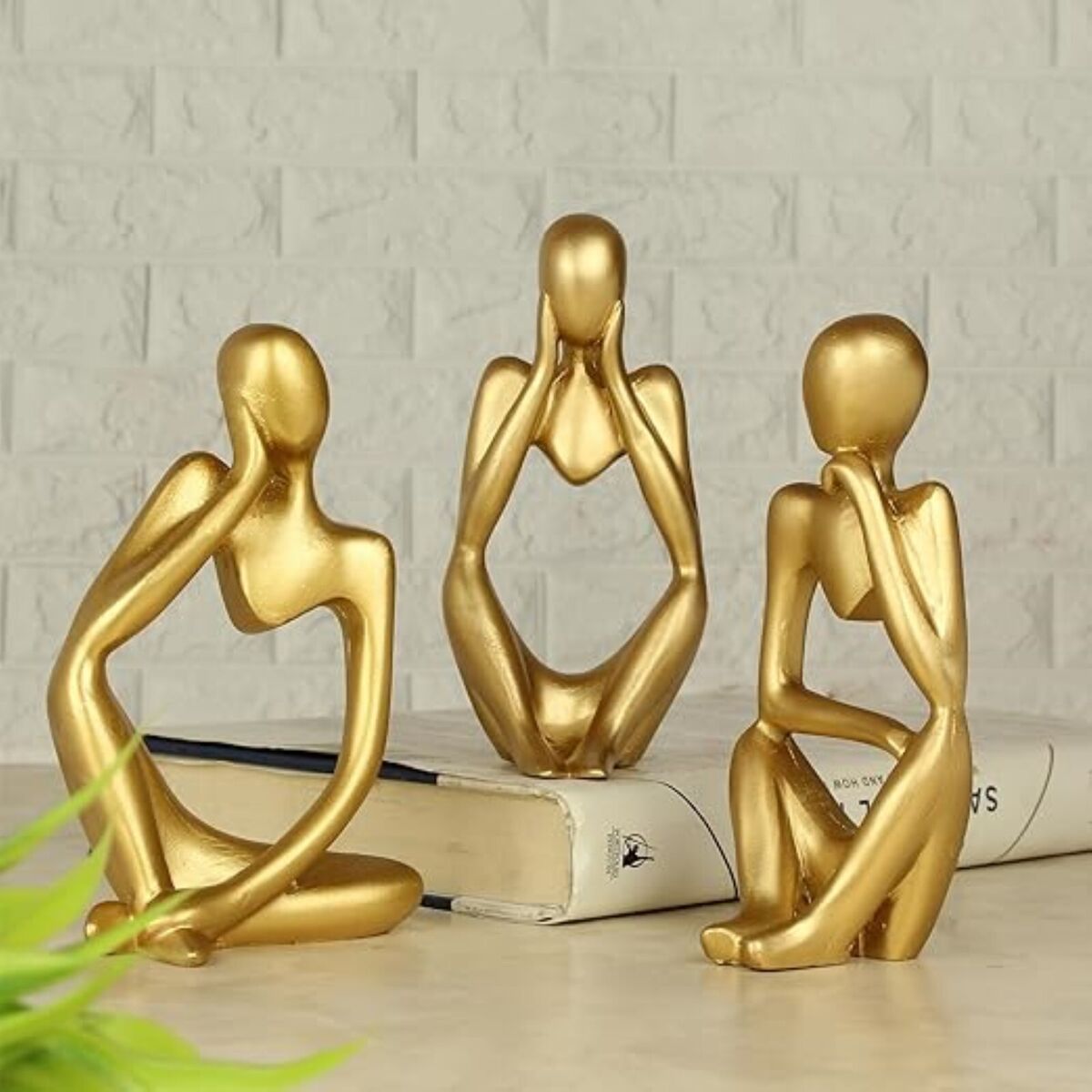 Elegant gold Thinker figure for modern home or office