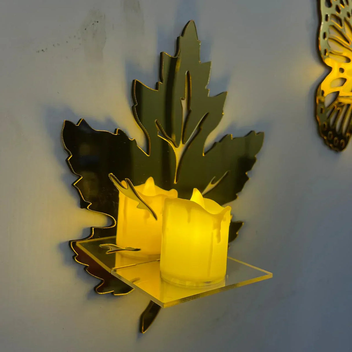 Golden acrylic wall shelves in leaf design