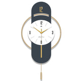 Close-up of golden pendulum and clock hands against gray-blue backdrop


