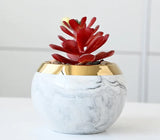 Close-up of pink marble ceramic vases with iron stand on shelf
