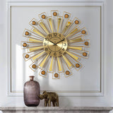 Front view of 24-inch golden metal wall clock by HBAK Choices

