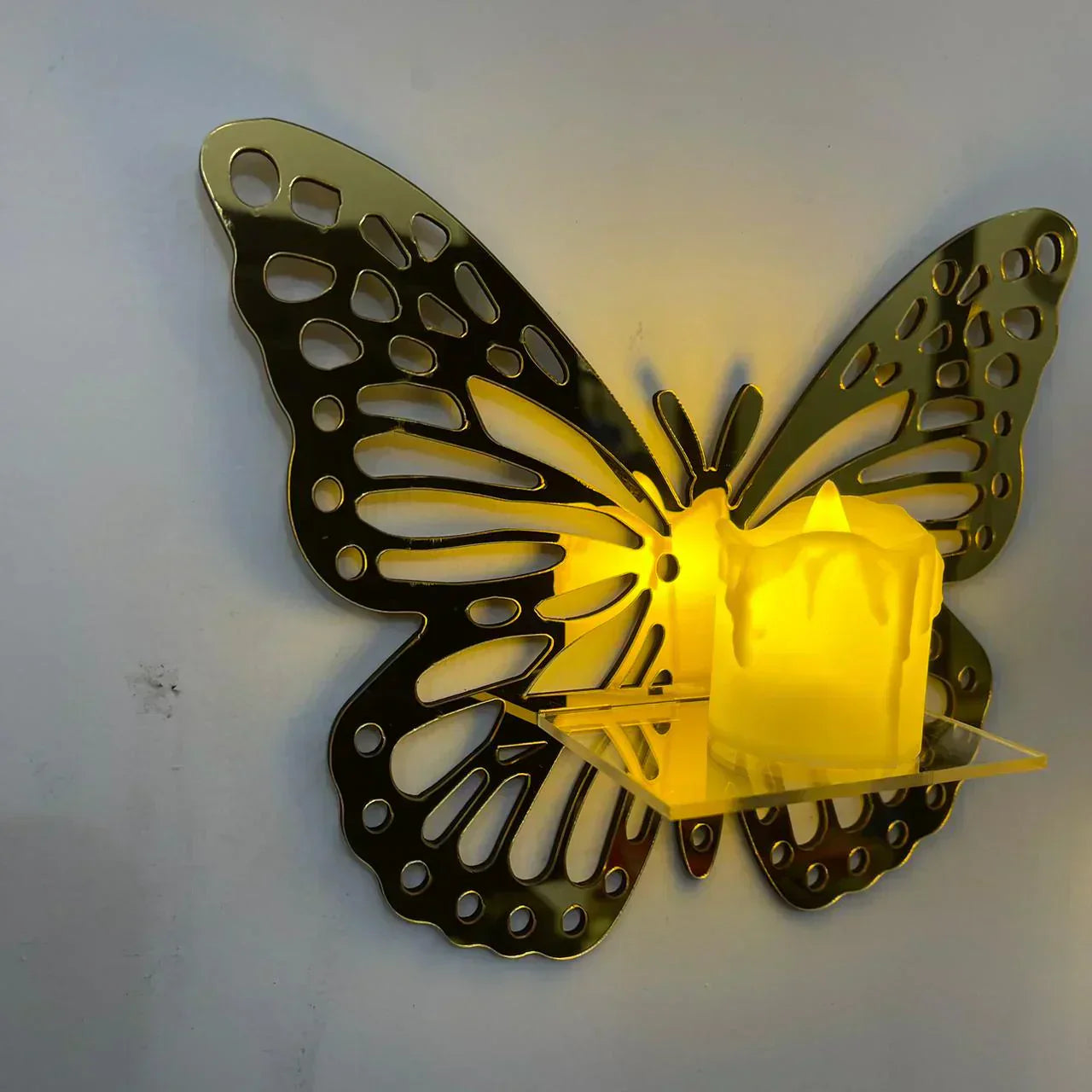 Golden acrylic mini wall shelves with LED candle