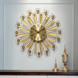 Golden wall clock mounted in a modern living room setting

