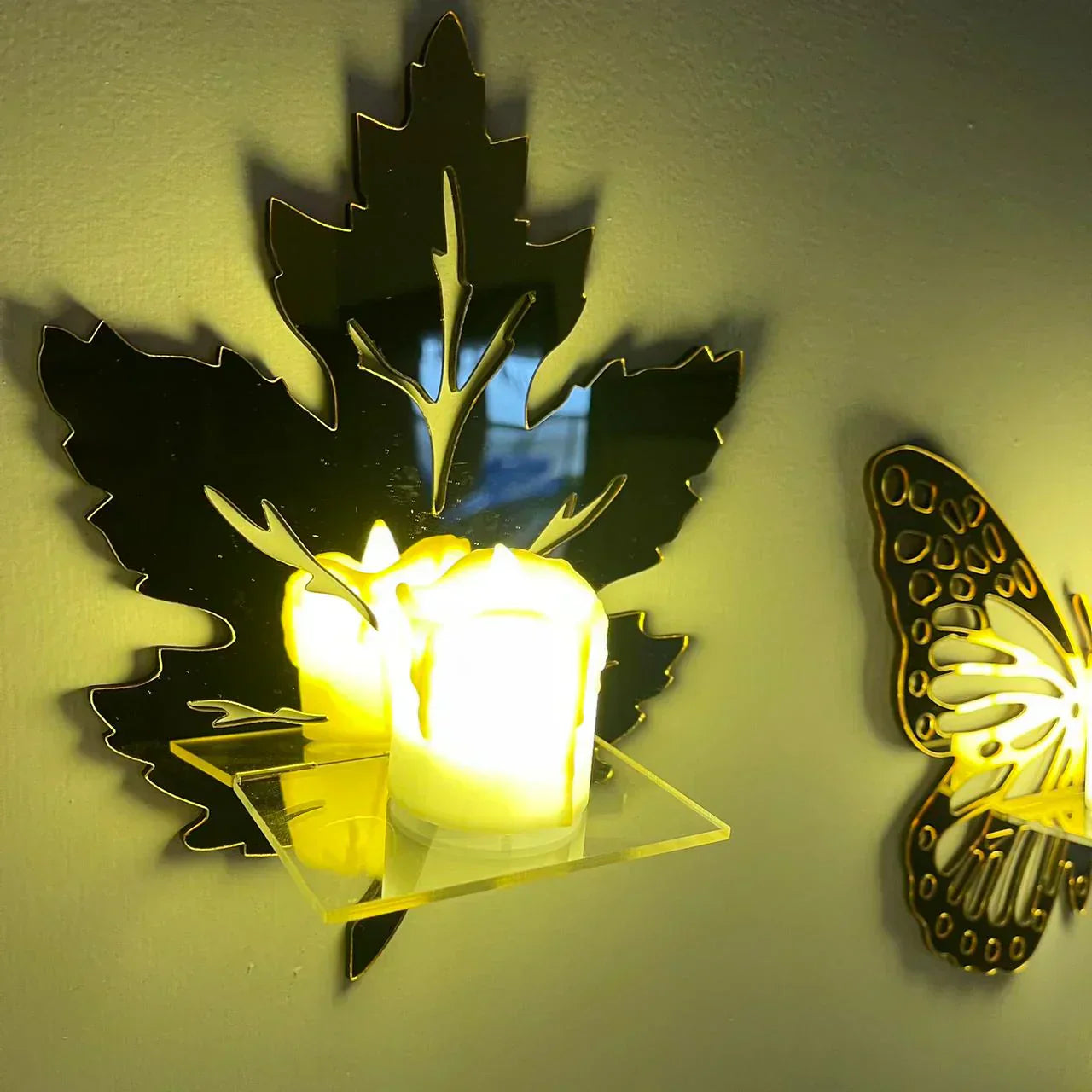 MDF floating shelf with swan silhouettes and a glowing LED candle