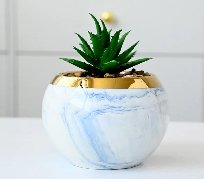 Modern pastel ceramic flower vases on metallic gold stands for decor
